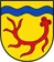 Wappen der Ortschaft Markhausen – eine rote Hirschstange auf goldenem Grund unter einem blauen Wellenbalken